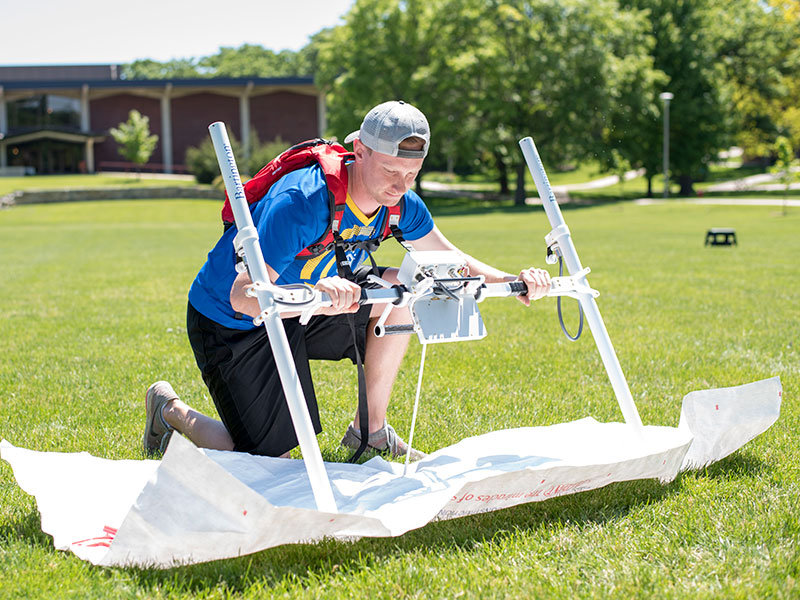 Luther College student performing anthropology field work