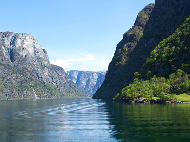 a beautiful lake surrounded by large mountains