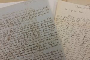 handwritten journals lying on a table