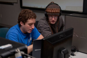 two Luther students using a computer together