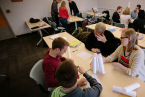 Luther students working together on a project at a table