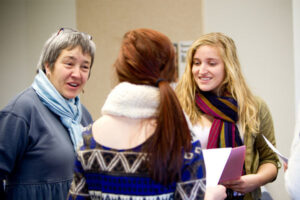 a Luther professor speaking to two students