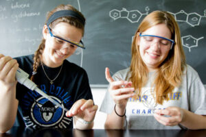 two Luther students doing an experiment in a chemistry lab