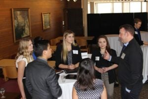 Alumni Ross Kurth speaking with Luther students