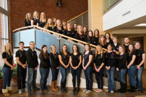 Luther nursing students gathered on a staircase