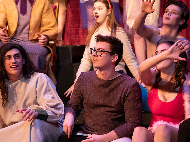 group of Luther students acting in a theatre performance