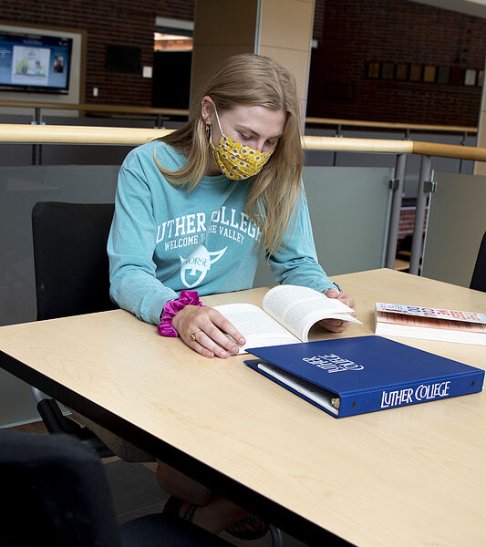 student studies for upcoming courses in Valders Hall lounge