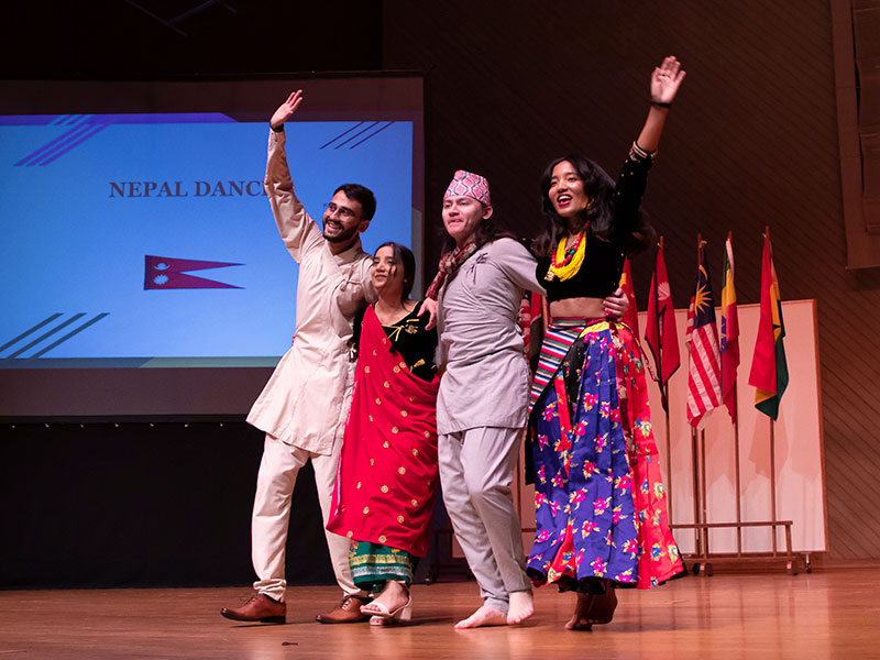 international Luther students performing a Nepalese dance in costume