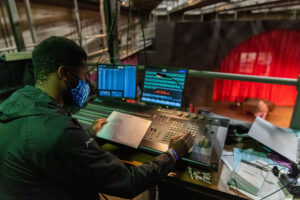 a Luther student using the lighting console in the Jewel Theatre