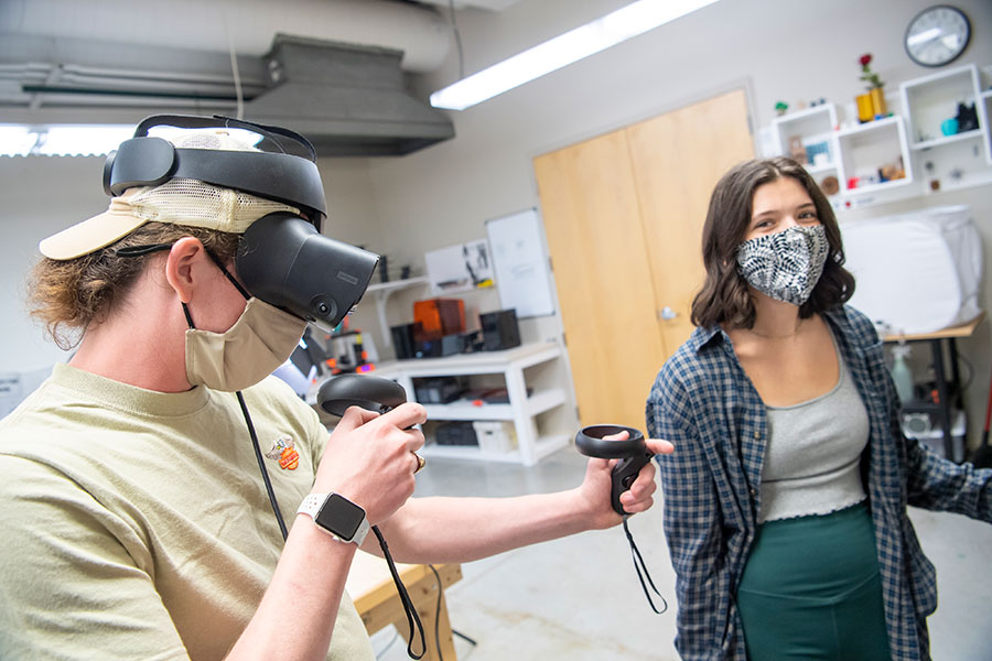 Luther students using VR googles in the Makerspace