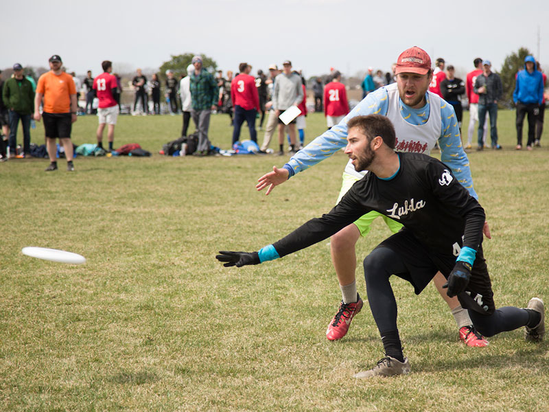 Luther students playing ultimate frisbee in a field