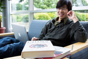 a Luther student studying in a lounge