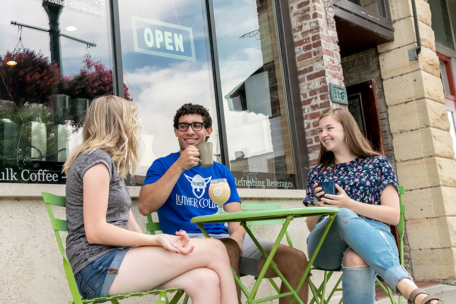 three Luther students enjoying coffee at Impact coffeehouse