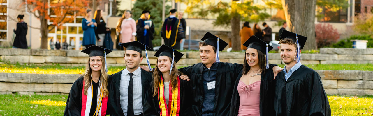 Picture of recent graduates in cap and gown