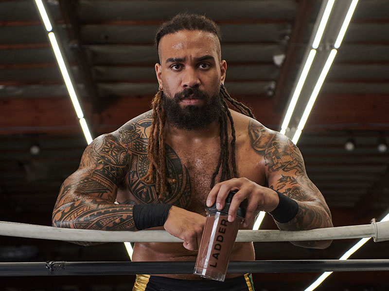 Photo of Jasper Kange leaning against boxing ring ropes