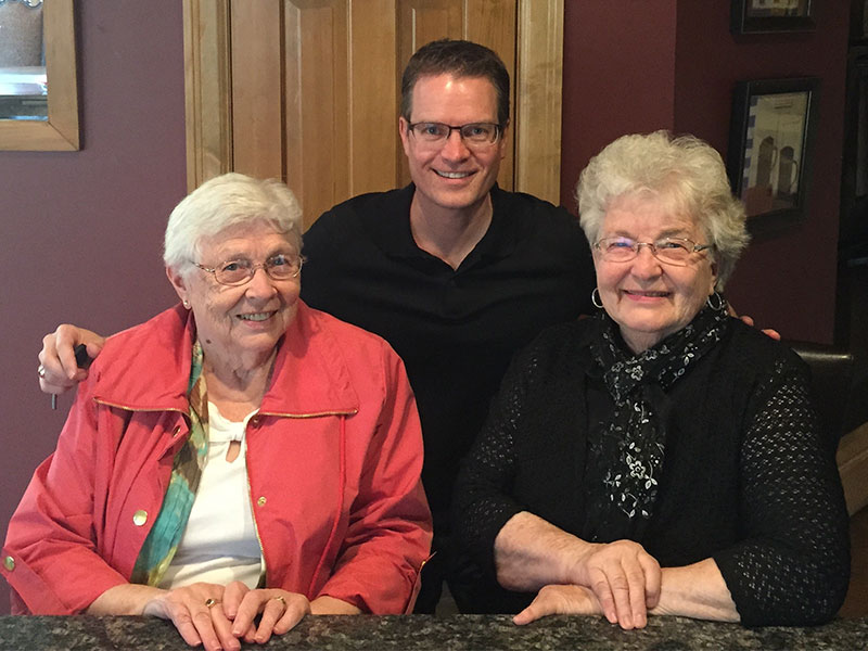 Photograph of GrandPad founder Scott Lien with his mother and mother-in-law.