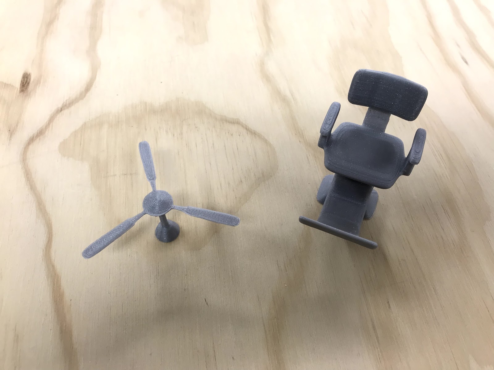 3D printed miniature ceiling fan and barber's chair.