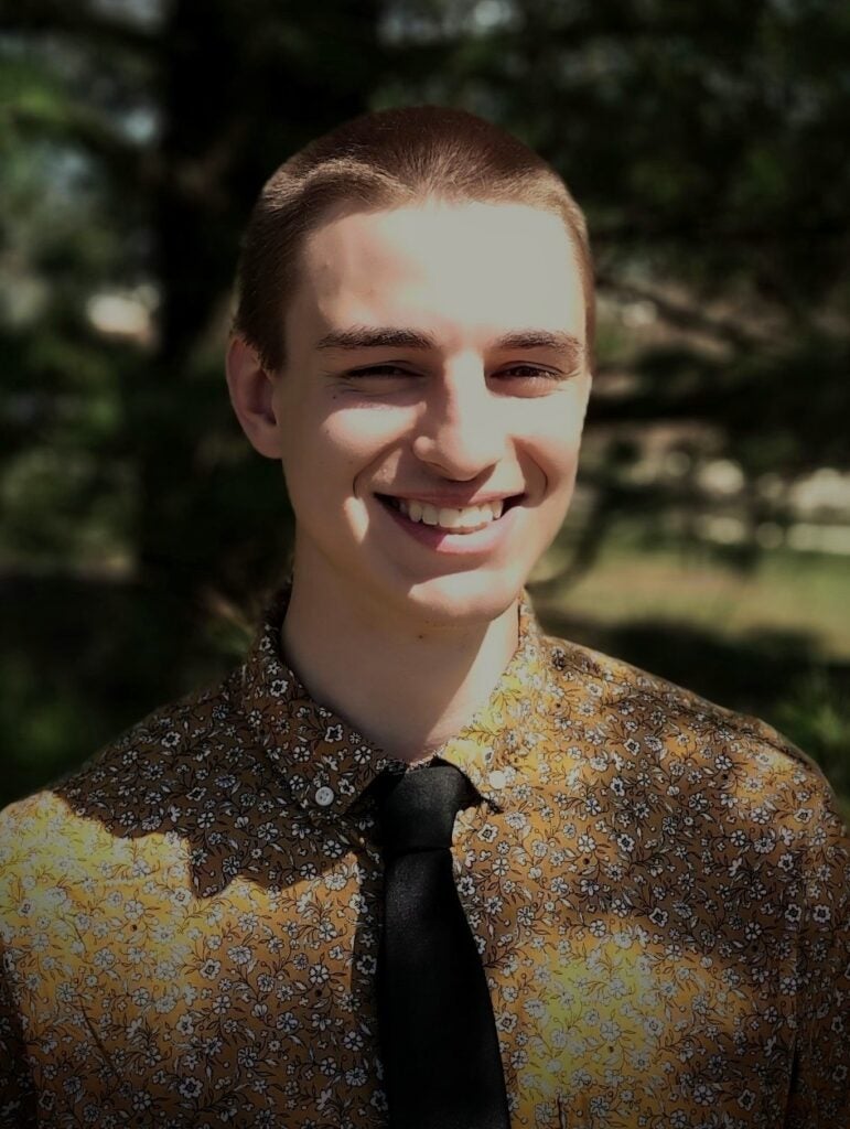 Joshua Hartl head and shoulders shot.