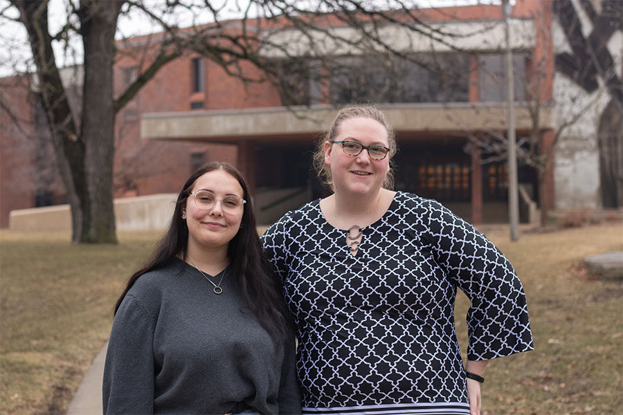 Two women standing outside