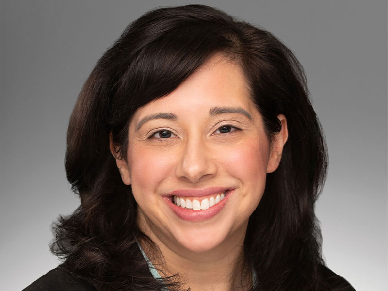 A head shot of a smiling woman