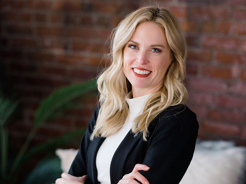 A head shot of a smiling woman