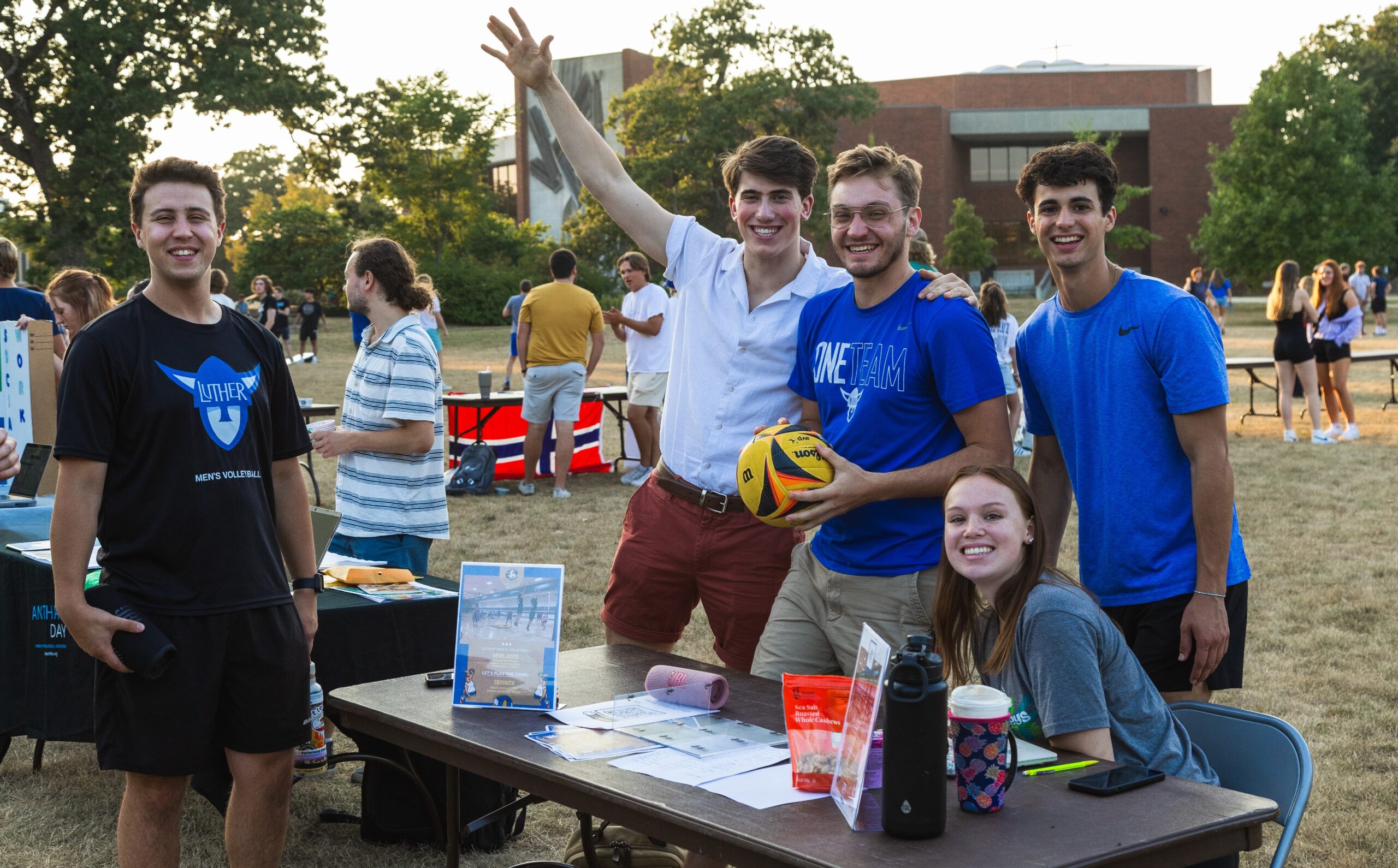 Students at a table for the student activities fair