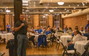 Dave Mitchell, head wrestling coach for Luther, speaks at the One Team Day celebration at T-Bock's.