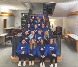 Tau Delta Gamma take group photo in Koren