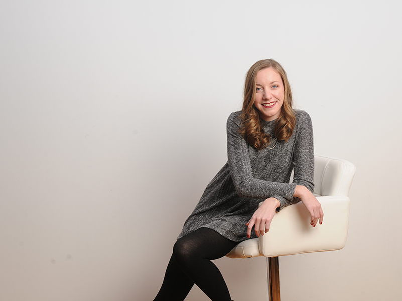 woman in gray dress on white chair