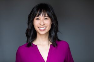 Head shot of Christine Cruzvergara wearing a magenta shirt