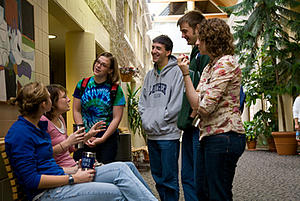 Students gather in the atrium of Jenson-Noble