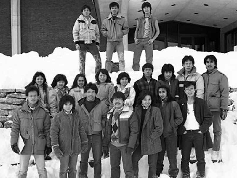 A group of college students standing in the snow