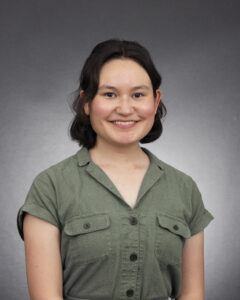 Portrait of Amy Webb against gray background.