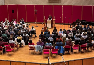 student speaking at chapel