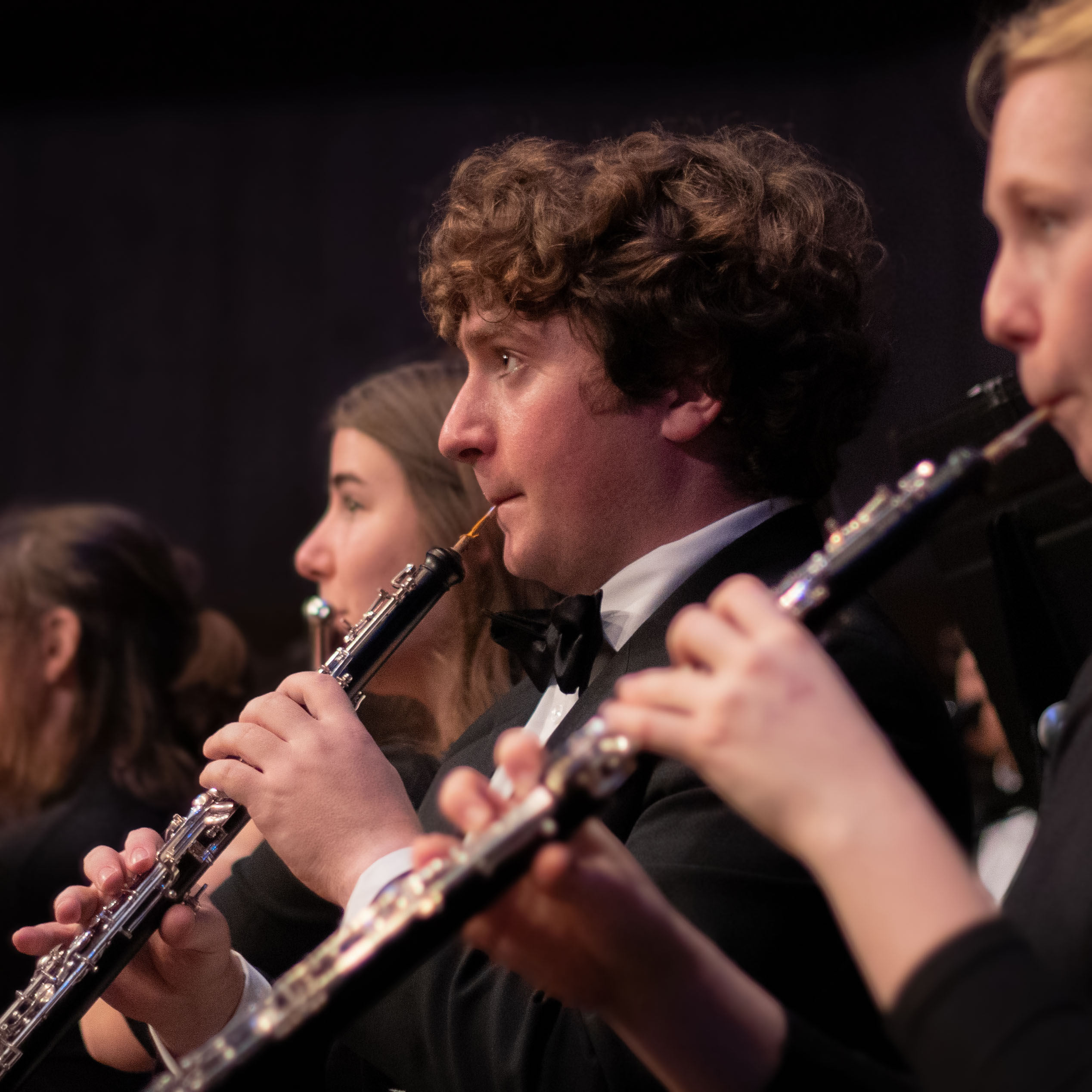 Robert plays his oboe in the orchestra.