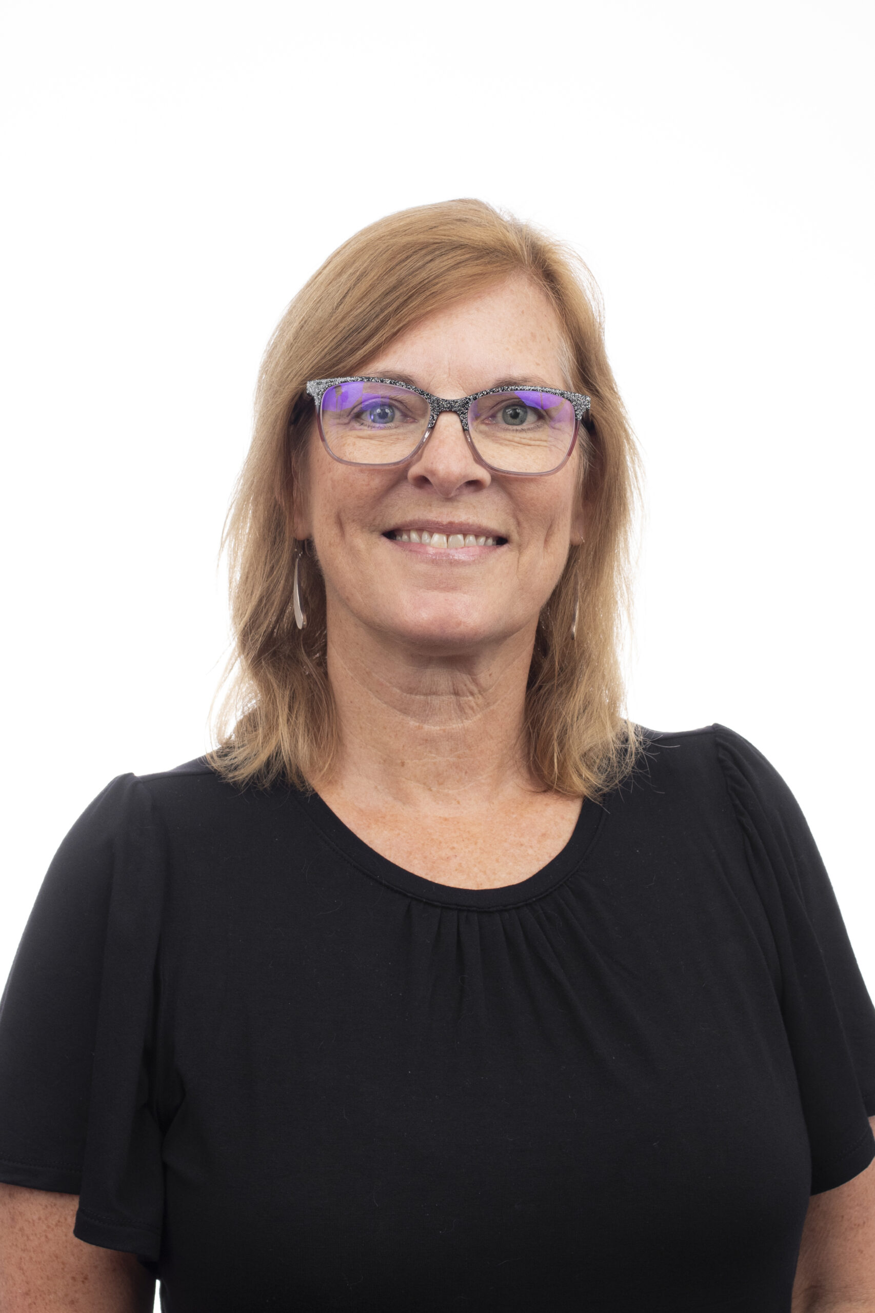 Kay Bronshteyn in a black shirt posing for a portrait
