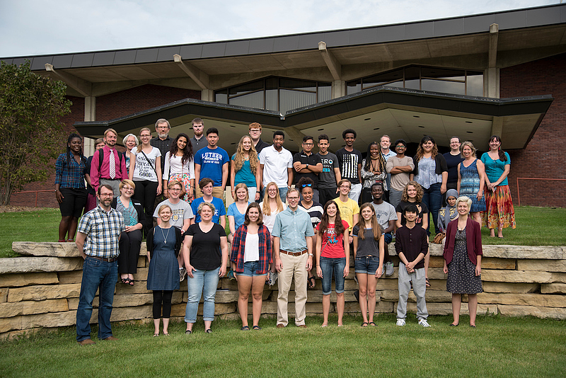 students and faculty working in Preus library take group photo