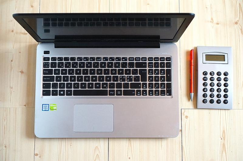 mobile computer with calculator and red pen