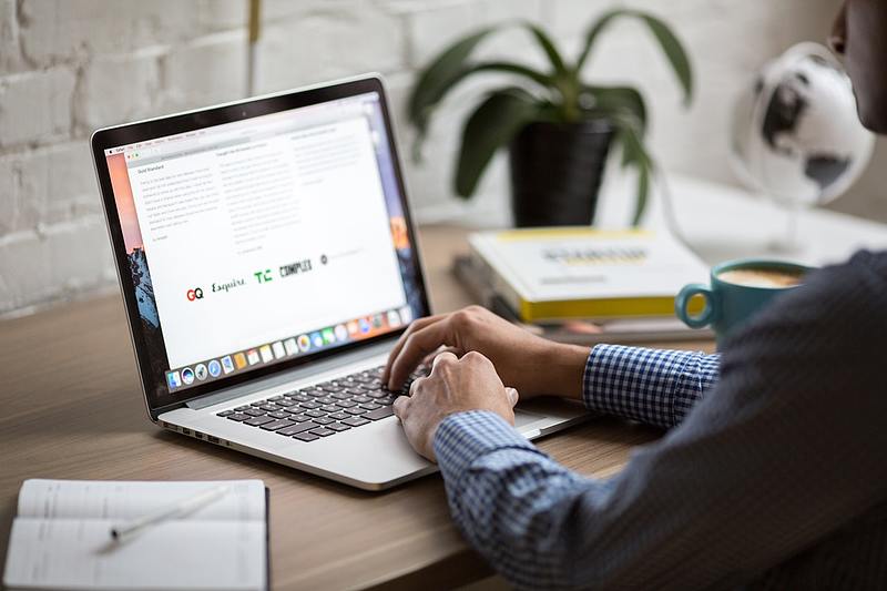person using computer to search web browsers