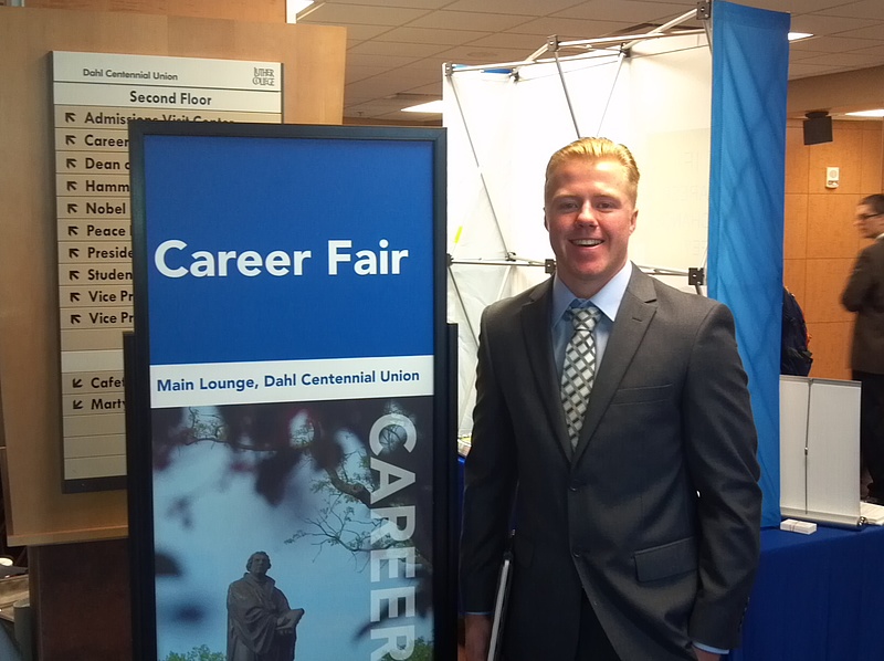 student dresses in formal attire for career fair