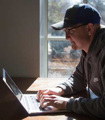 student uses computer to look at online options