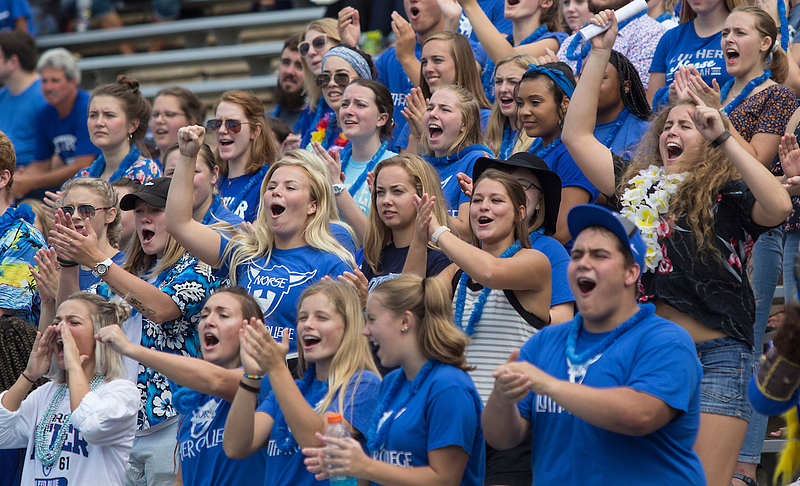 group of luther students cheering