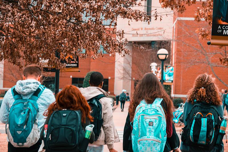 students walking towards building