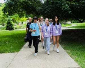 Middle school students walking on Luther's campus.
