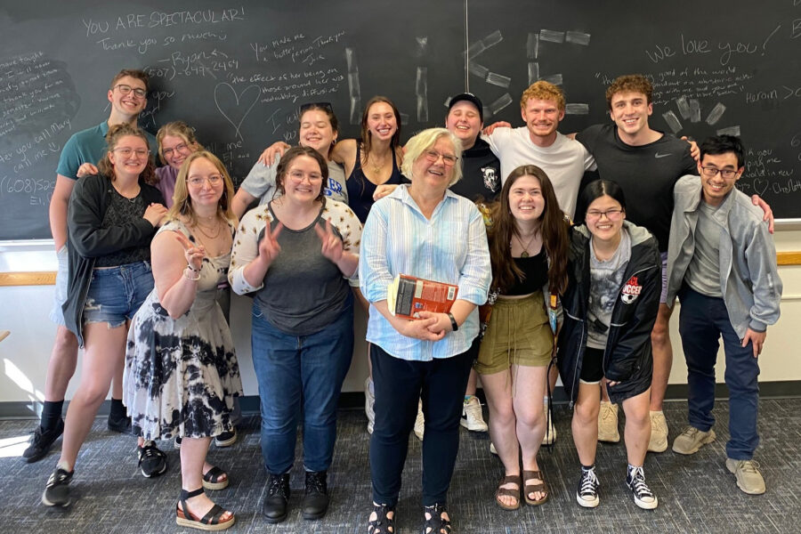 Lise Kildegaard stands with a classroom of students