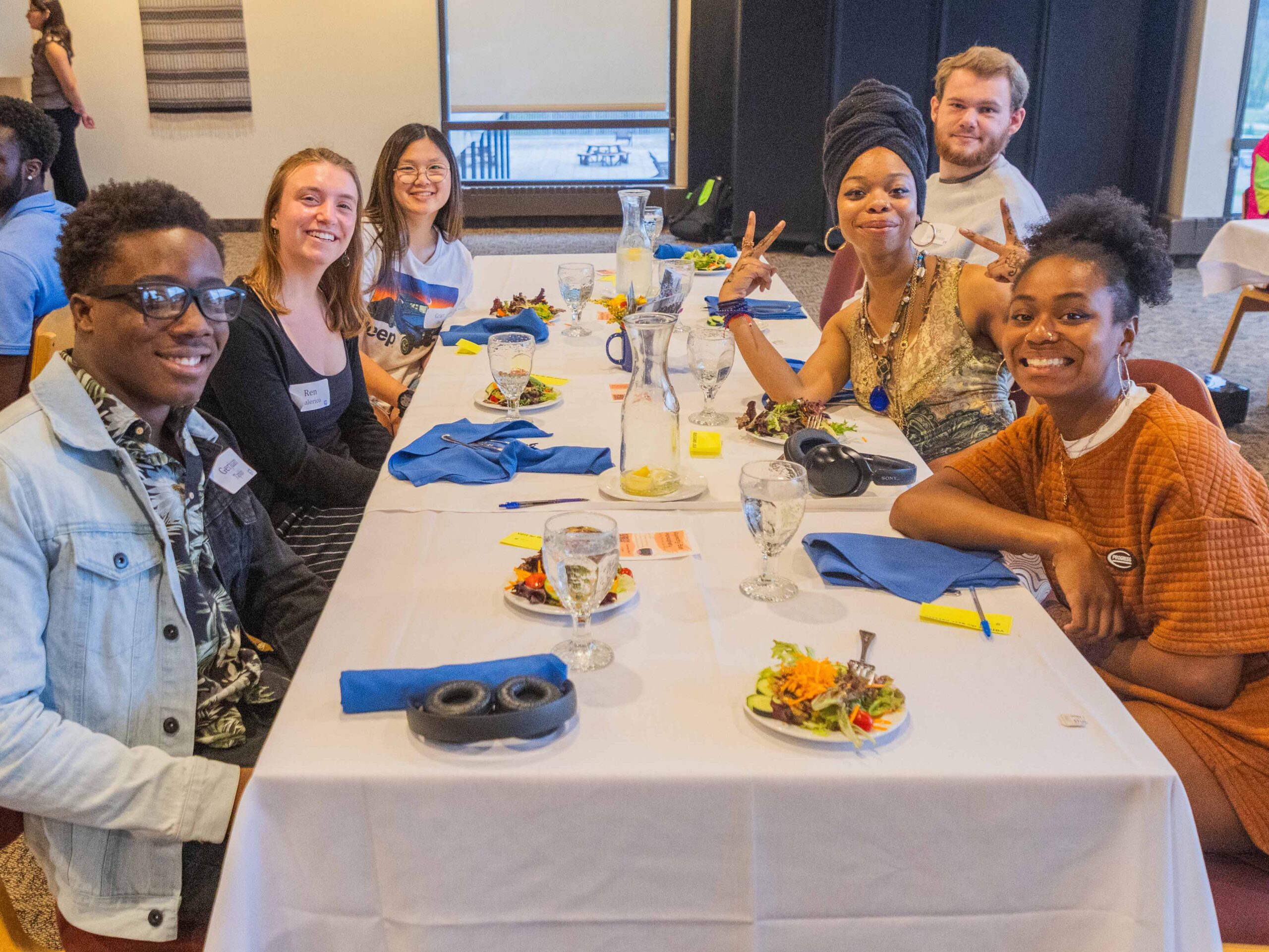 Group of smiling students at a table