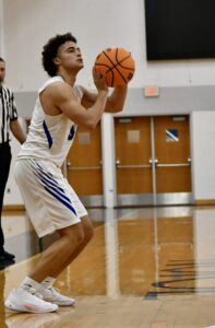 Fahbian Grace shooting a basket