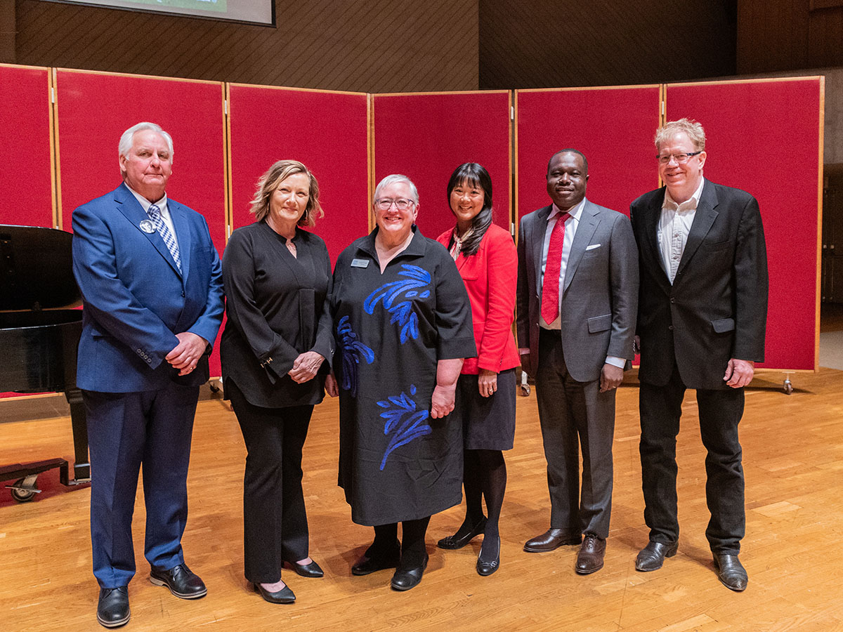 The Distinguished Service Award winners on stage in the Center for Faith and Life with President Ward.
