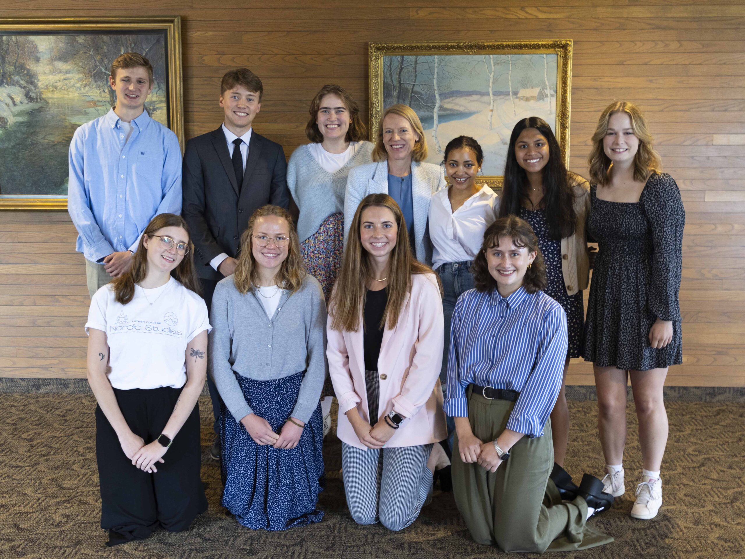 Group photo of 10 students and the Norwegian foreign minister
