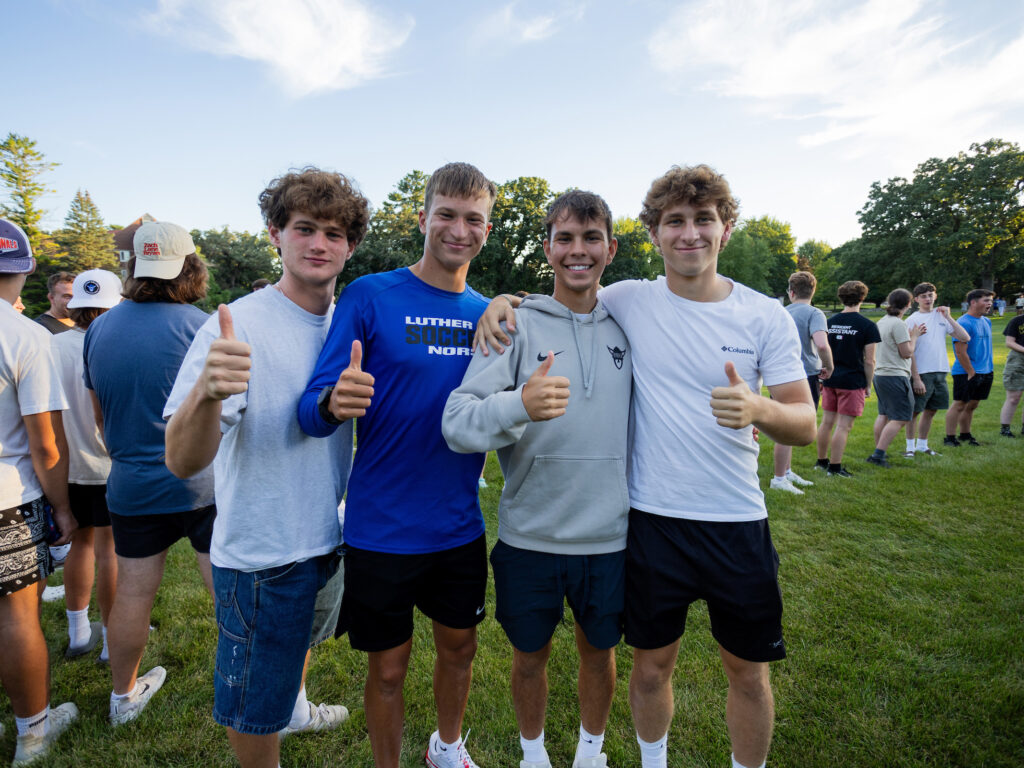 4 students give thumbs up